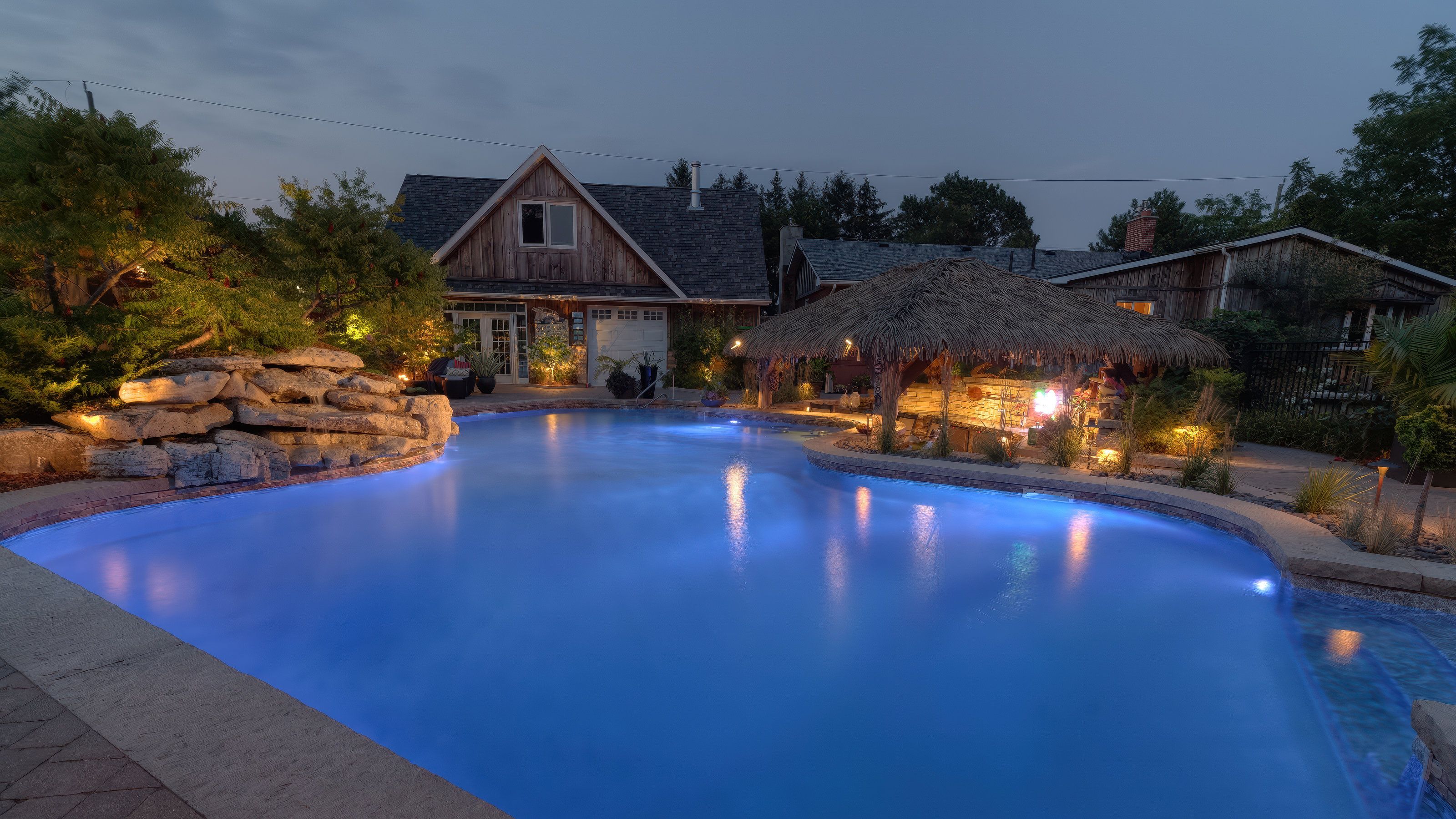 Backyard resort-style landscape lighting