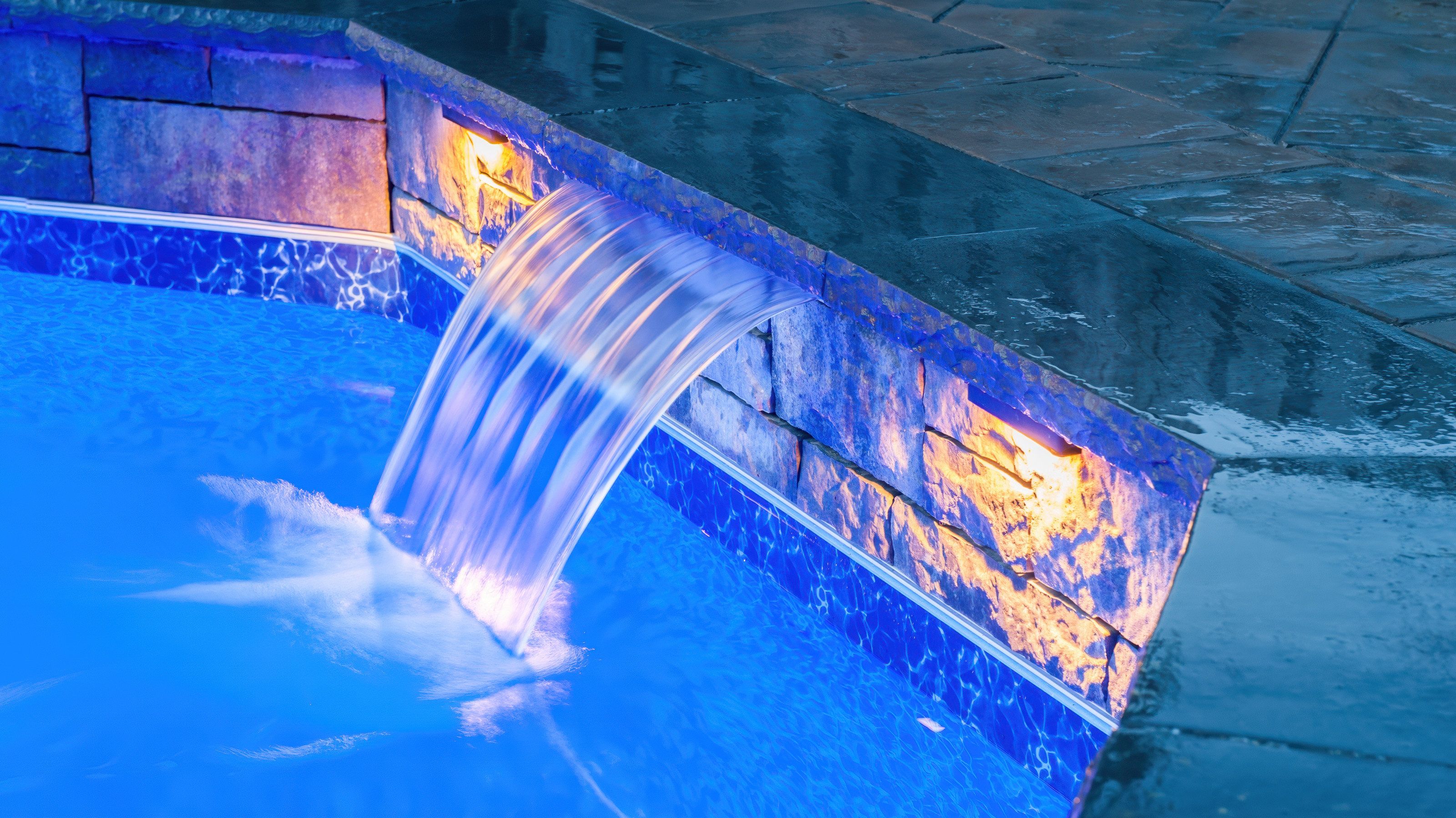 Dramatic waterfall lighting at night