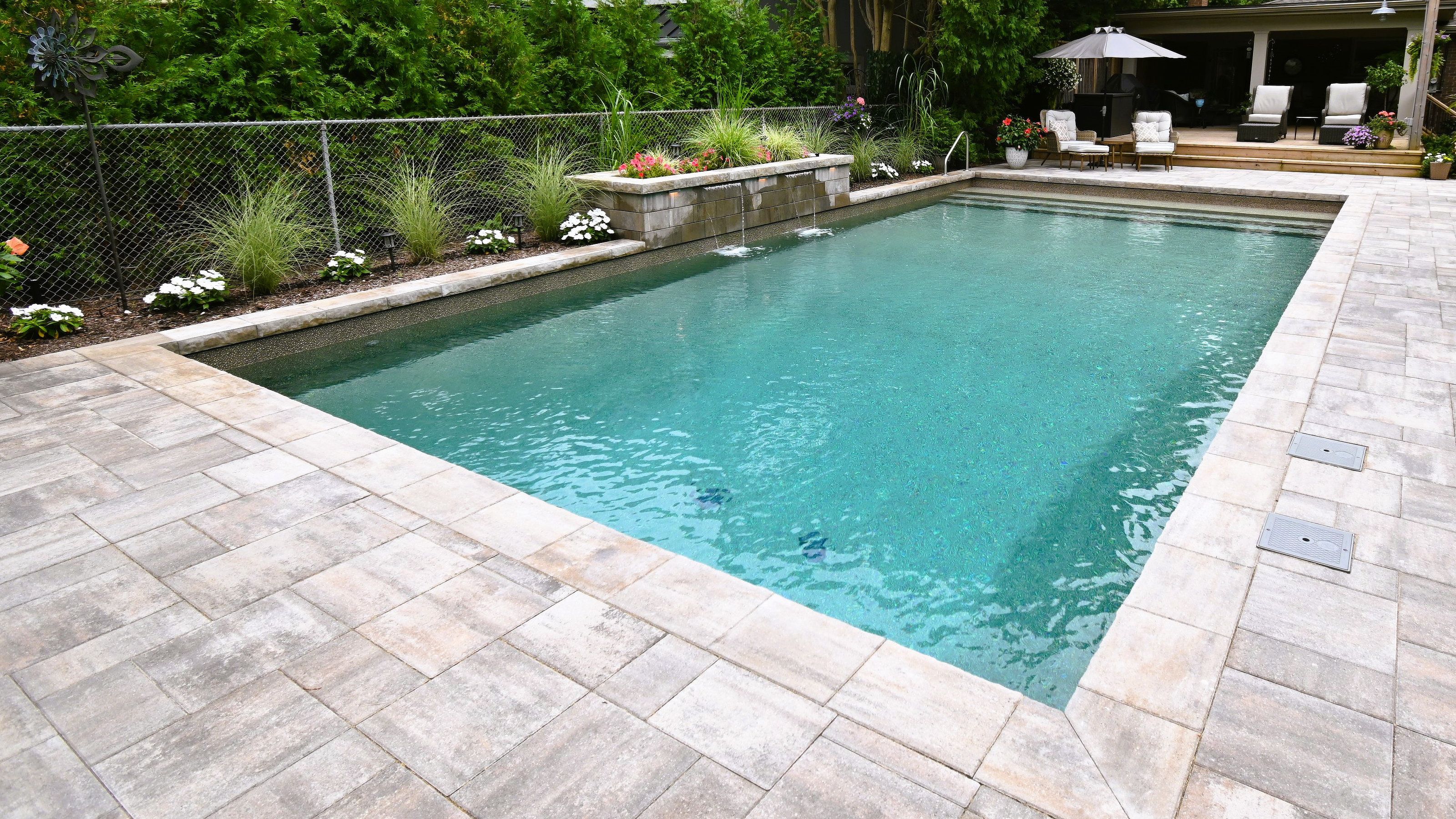 Luxury swimming pool with natural stone decking