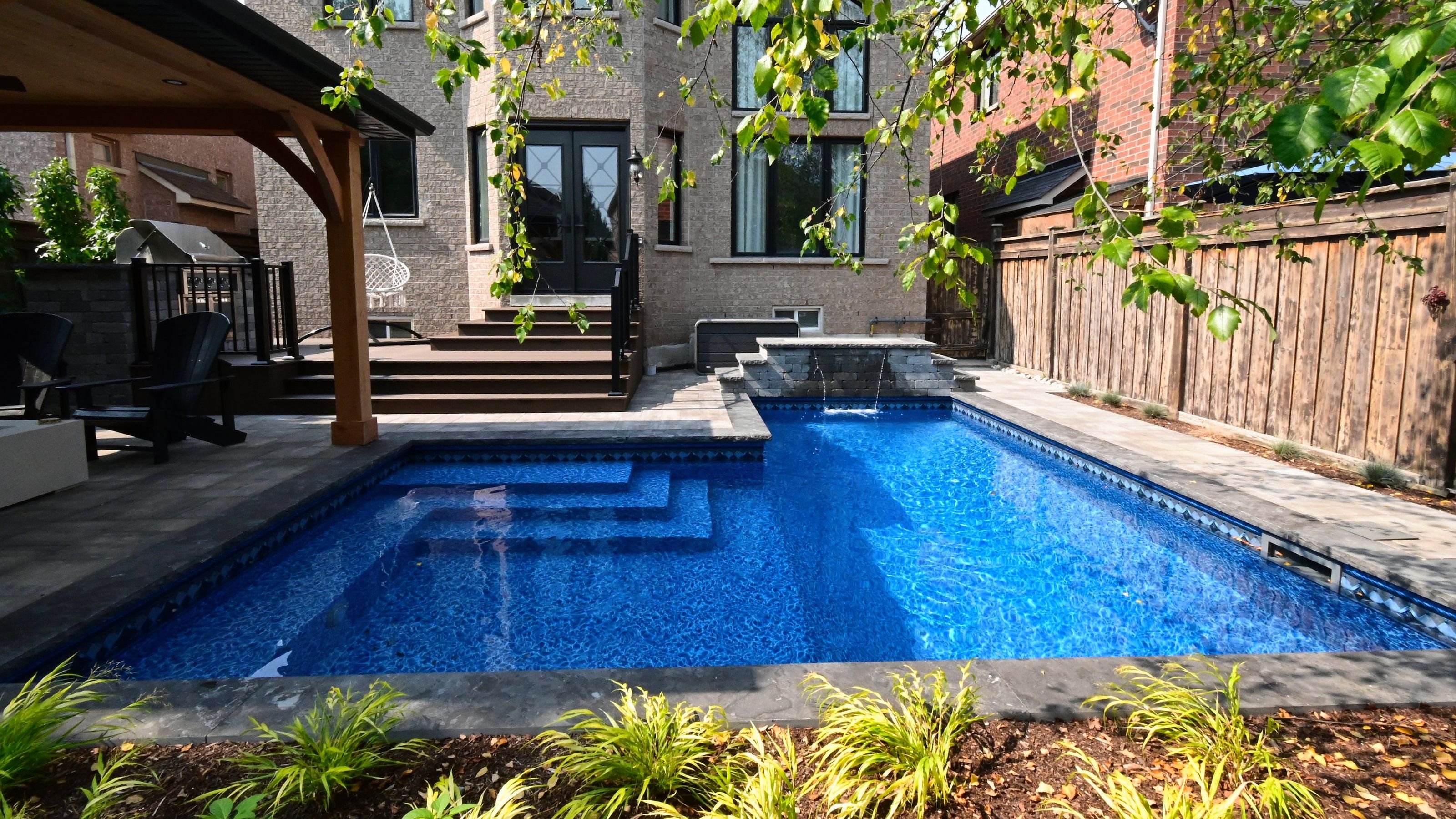 Luxury swimming pool with outdoor kitchen